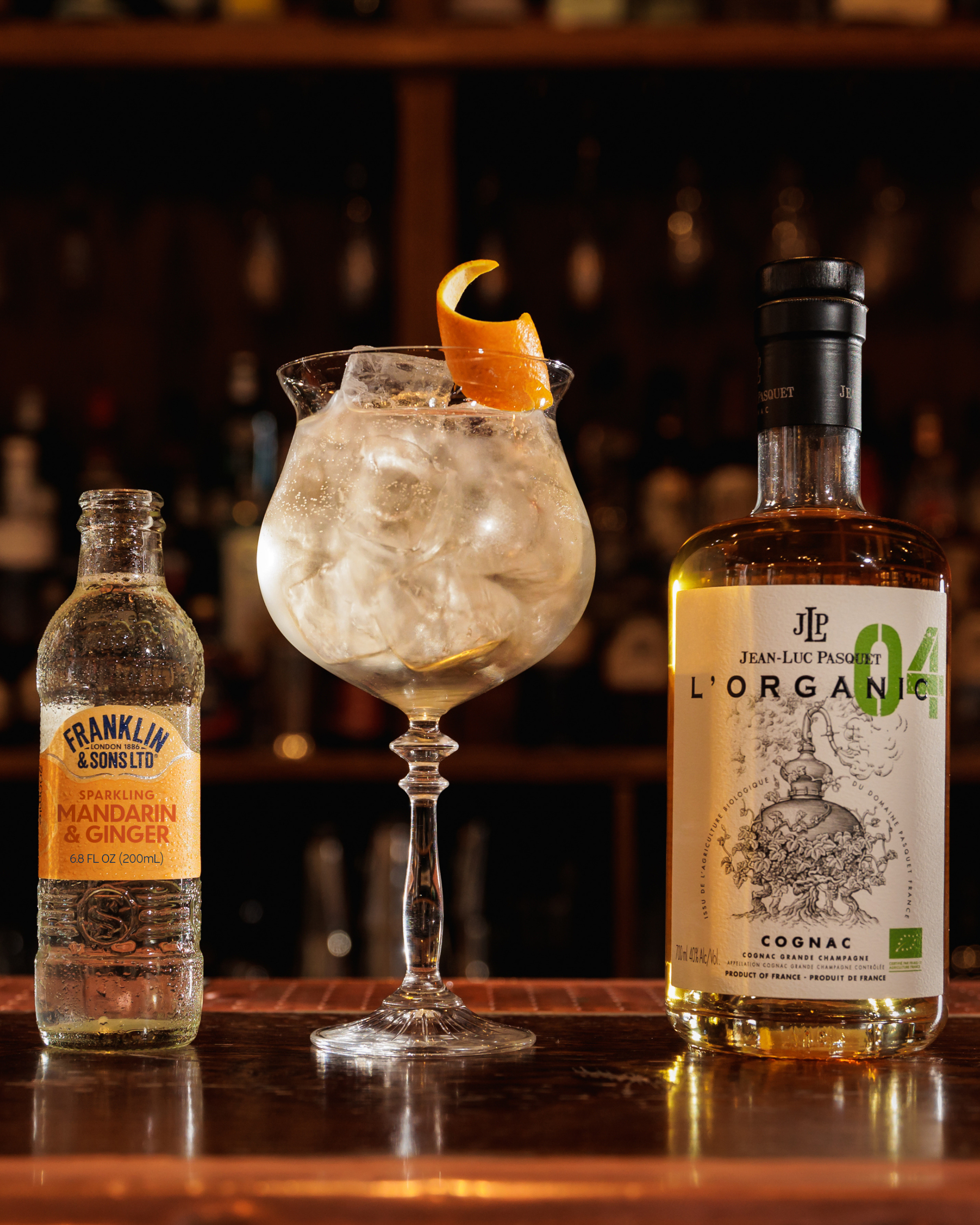 Cognac highball cocktail next to Sparkling Mandarin & Ginger | Franklin & Sons US